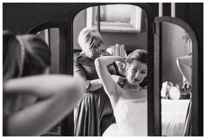 Mother of the Bride helping to get the bride wedding ready 